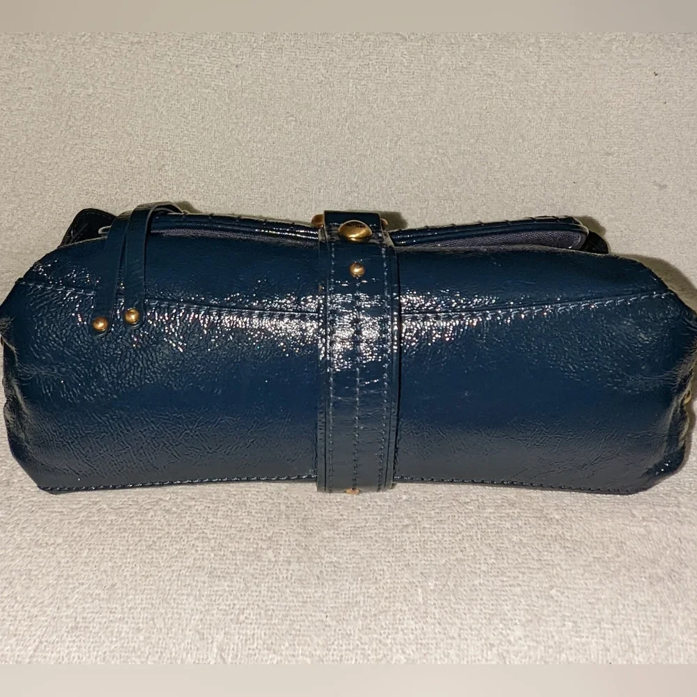 The  Sak navy blue patent leather hobo bag.